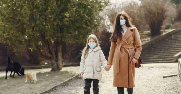 https://www.pexels.com/photo/mother-with-daughter-in-face-masks-walking-in-park-4000622/